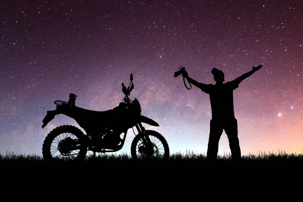Silhouette of tourists adventuring with motorcycles, dirt bikes or motocross in the evenings. travel and adventure concept