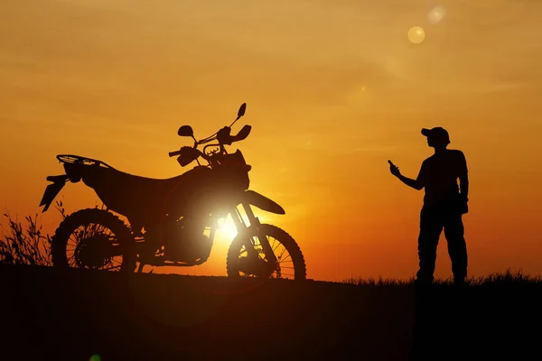 Man traveling freely with a motocross bike. motorcycle travel concept