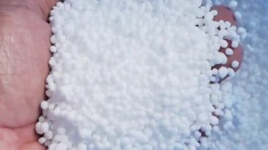 The concept of more expensive chemical fertilizers. White chemical fertilizer formula 46-0-0 focuses on plant growth.