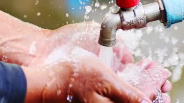 Clean water for life. Man washing hands. Good water management makes water available forever.