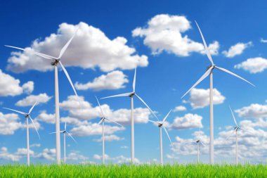 Rüzgar türbini çayırda elektrik üretir. Temiz enerji kavramı alternatif enerji.