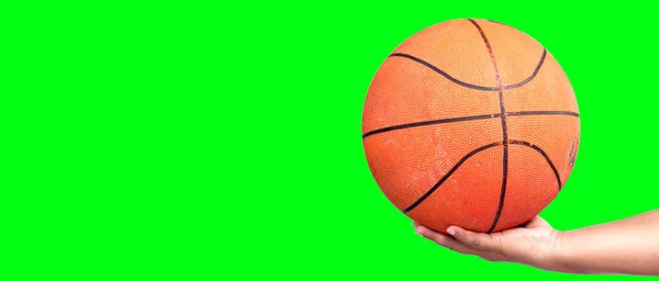 hand holding basketball ball. basketball in hand with clipping path