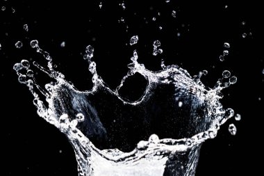 Splashing water on a black background. water splash refreshing black background