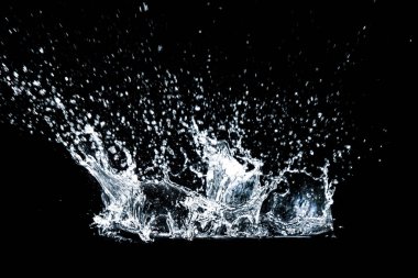 Splashing water on a black background. water splash refreshing black background