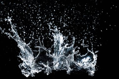 Splashing water on a black background. water splash refreshing black background