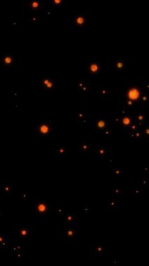 Parlak turuncu bokeh parçacıklarının döngü hareketlerinin grafikleri siyah arkaplanda akmaktadır