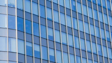çağdaş gökdelen mavi cam pencereli, modern bina dış tasarımı