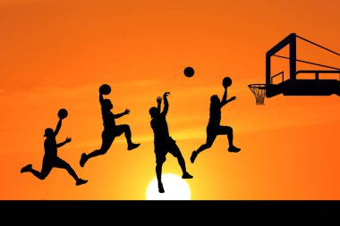 Basketbolcuların silueti zıplıyor ve arka planda basketbol potası olan canlı turuncu bir günbatımı gökyüzüne ateş ediyor..