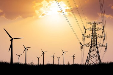 Siluetli rüzgar türbinleri ve enerji hatları canlı bir günbatımı gökyüzüne karşı yenilenebilir enerji ve modern altyapıyı simgeliyor..