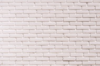 Beyaz tuğla bir duvarın yüksek çözünürlüklü görüntüsü, arka plan, doku ve tasarım projeleri için mükemmel.
