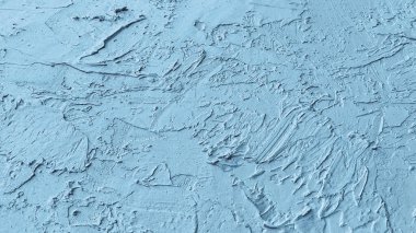 Sanatsal fırça darbeleriyle dokulu mavi bir yüzeye yakın plan ve yaratıcı tasarım projeleri için ideal.