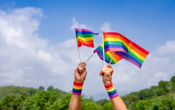 People Hand Holding Lgbt Colorful Rainbow Gay Flag Background Blue — Stock Photo, Image