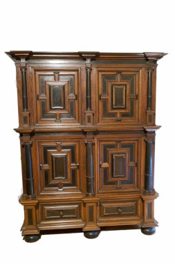 This wooden cabinet features a detailed design with geometric patterns and elegant columns. Its rich finish adds warmth to the room, perfect for displaying decor and storage.