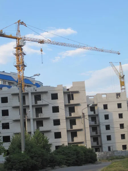 Construction of an apartment building - lifting crane