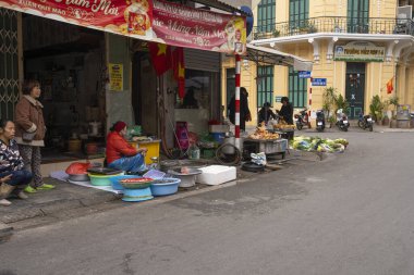 Hanoi, Vietnam, January 2023. the meat and fish vendors on the street in the old quarter in the city centre