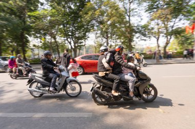 Hanoi, Vietnam, January 2023.  the traffic of mopeds in the streets of the city centre