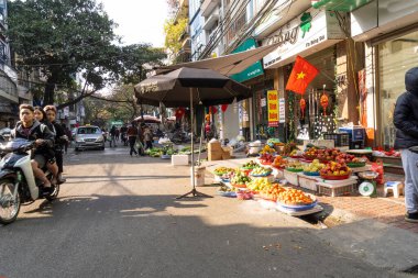 Hanoi, Vietnam, January 2023.  panoramic view of  the traditional food vendors on the  street in the city center