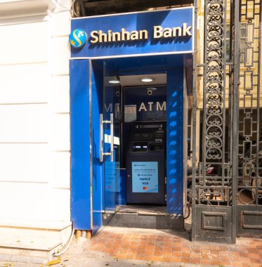 Hanoi, Vietnam, January 2023. View of a Shinhan bank ATM machine on the street in the city center