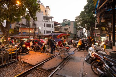 Hanoi, Vietnam, January 2023.  the passage of a train along the tracks between the houses of the old district of the city centre
