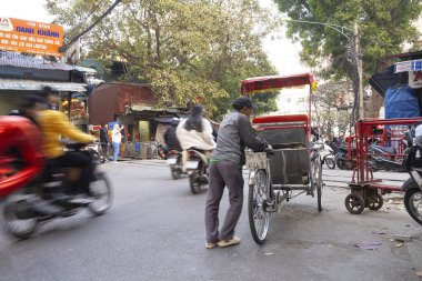 Hanoi, Vietnam, January 2023.  the traffic of mopeds in the streets of the city centre