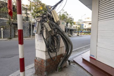 Hanoi, Vietnam, January 2023. a tangle of electrical cables in a city center street