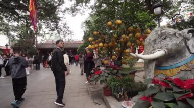 Hanoi, Vietnam, January 2023. View of worshipers in the Quan Thanh Taoist temple in the city center