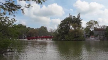 Hanoi, Vietnam, January 2023.  view of Ngoc Son Temple, a Confucian temple on the Hoan Kiem lake crossed by a bridge, with tower and pavilions dedicated to the national hero.