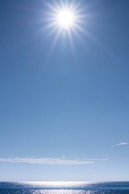 the sun shining over the sea