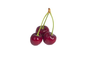 Bazı taze kirazlar şeffaf bir yüzeyde izole edilmiş.