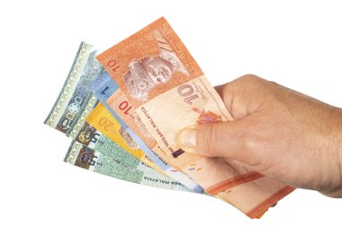 Elinde Malezya Ringgit banknotları var.