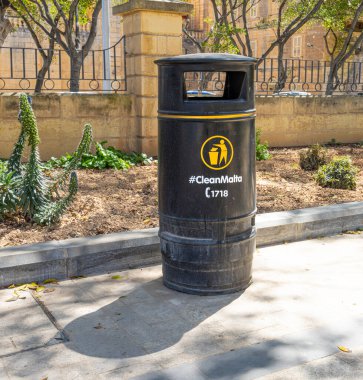 Valletta, Malta, April 03, 2024. a rubbish bin in the Maglio gardens in the city centre clipart