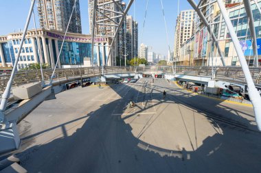 Shanghai, China. January 8, 2025. an elevated pedestrian crossing over a major intersection in the city centre clipart