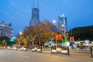 Shanghai, China. January 9, 2025.  view at dusk of the modern buildings in Piazza del Popolo in the city centre clipart