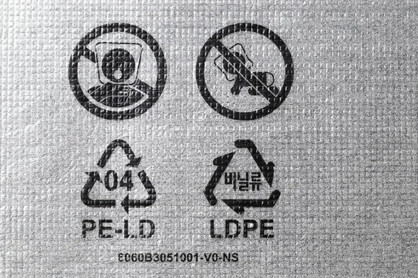 Plastic packaging symbols: warning to keep bags away from children, recycle icon, recyclable symbol 04 PE-LD