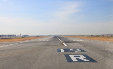 Airport Runway 19R ready for plane take off with good weather condition.