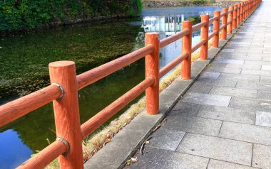 Concrete fence made to look like wood along the Canalside walkway.