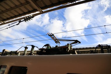 Pantograph of an electric train connecting the train to the overhead catenary wire clipart