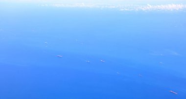 Aerial view of the Singapore Strait, Ocean liner, tanker and Cargo Ship in Singapore Strait, View from plane. clipart
