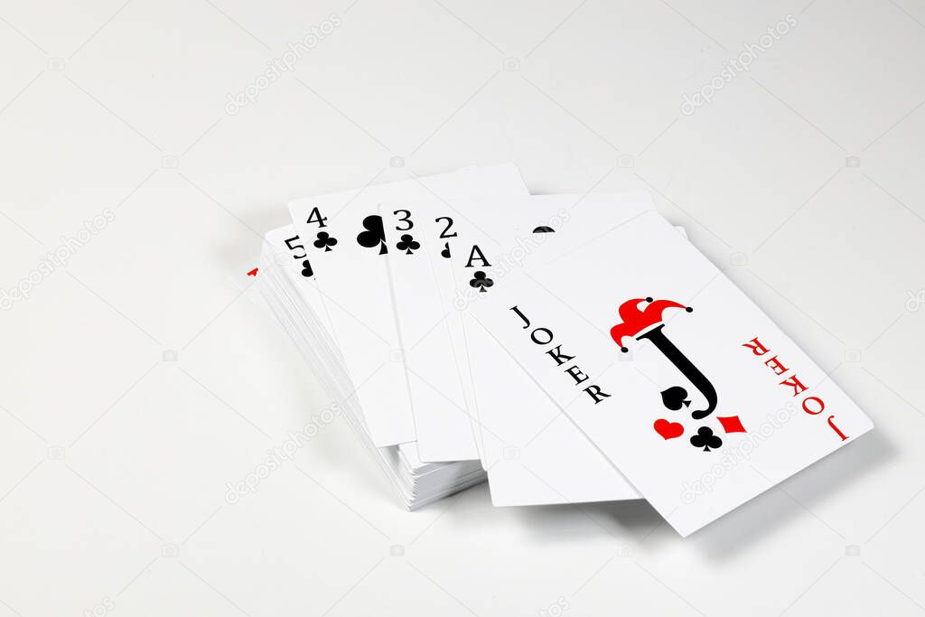 Flying playing card for poker and gambling,  top with Joker - isolated on white background.