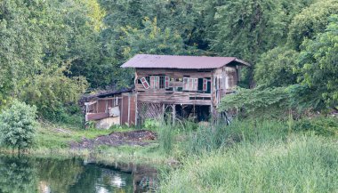 abandoned molder wooden house, derelict, weathered home at countryside. clipart