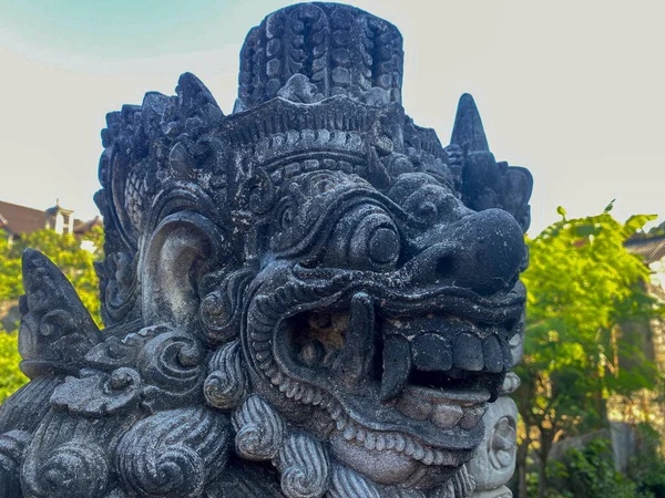 Stone statue in the form of a guardian deity according to Balinese Hindu belief