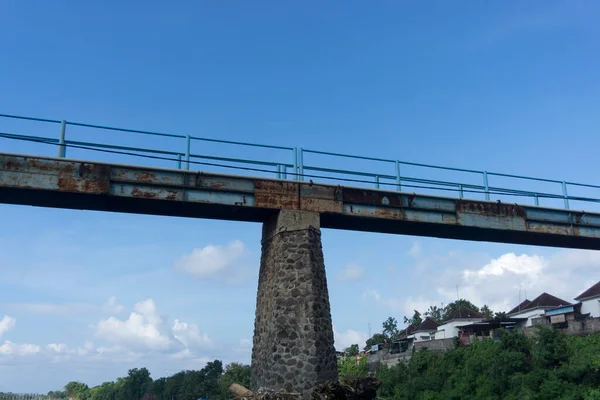 View from below of a small bridge over Yeh Unda dam in Klungkung, Bali