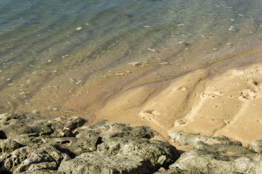 Background of white sand and sea water