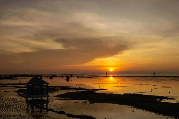 stock image View of the beach at low tide at sunrise