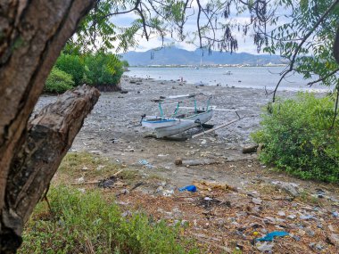 Bima, West Nusa Tenggara (December 7, 2024) :Abandoned boat on the edge of Amahami Beach, Bima City clipart