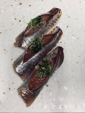 Fish sushi on a white plate