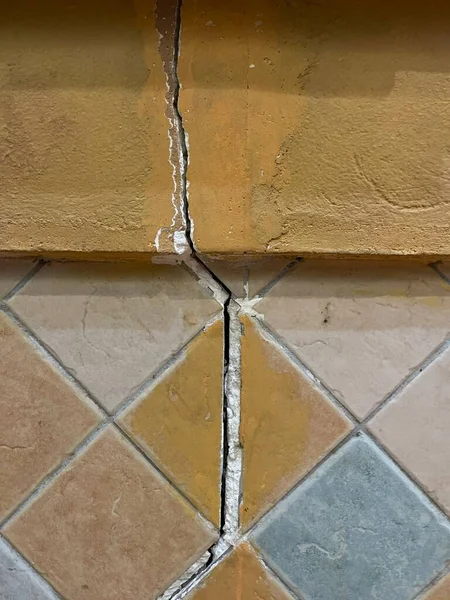The yellow tile was broken into long marks.
