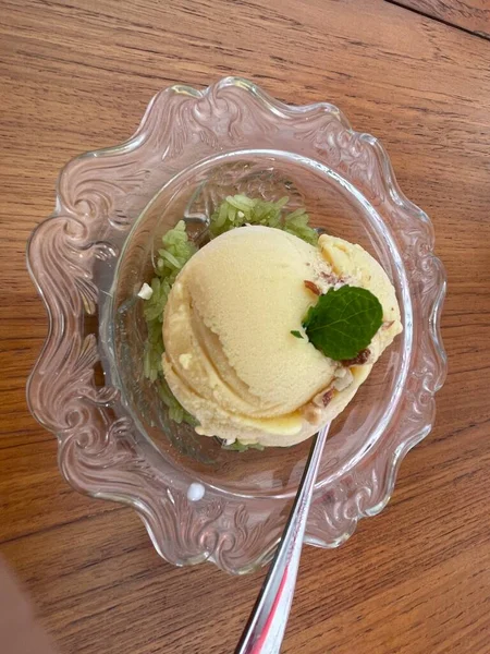 Durian and sticky rice-flavored ice cream in a cup.