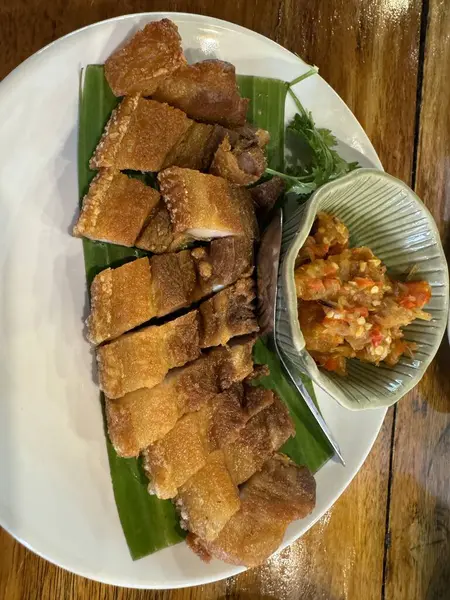 stock image Stir-fried pork belly and chili paste are arranged on a white plate.