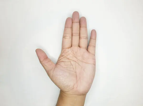 Beyaz arkaplanda izole edilmiş işaret gösteren bir kadın eli